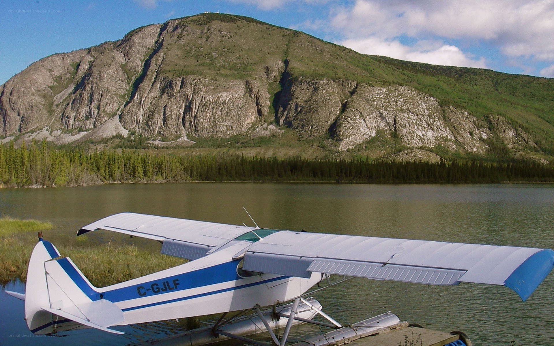 Seaplane on a lake with mountains