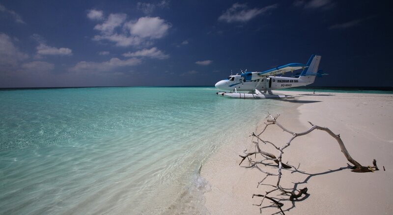 Seaplane on Beach — Blue, Serene, Afternoon
