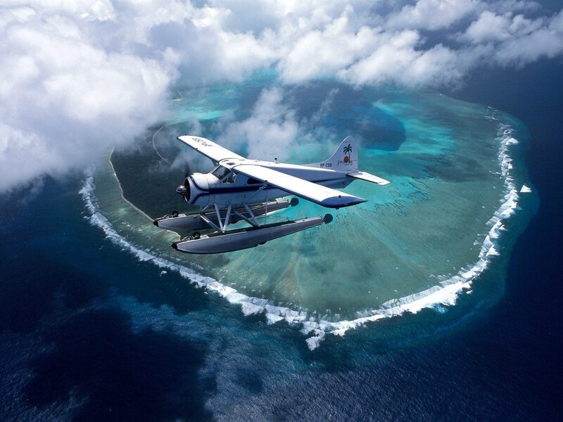 Seaplane over Atoll — Blue