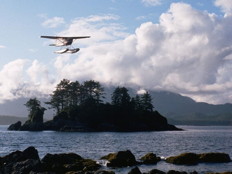 Seaplane over coastal island