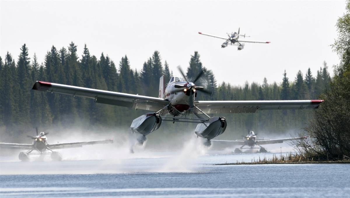 Seaplanes taking off from water