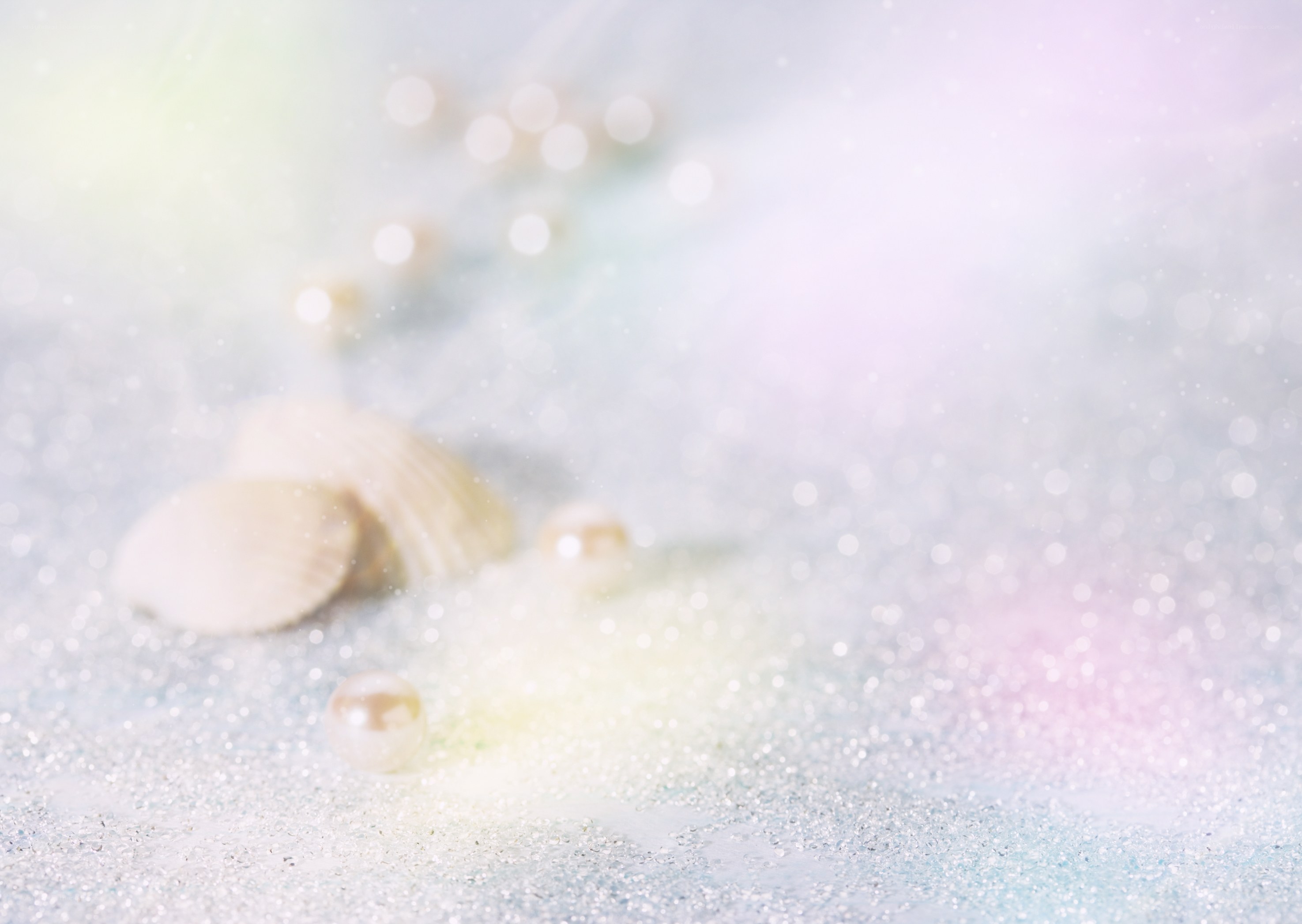 seashells and pearls on sand
