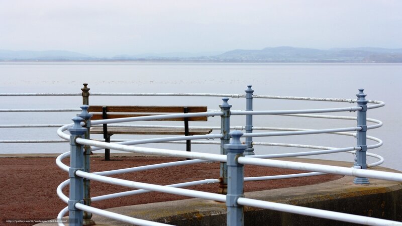 Seaside bench with railing