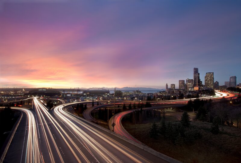 Seattle skyline at dusk with traffic