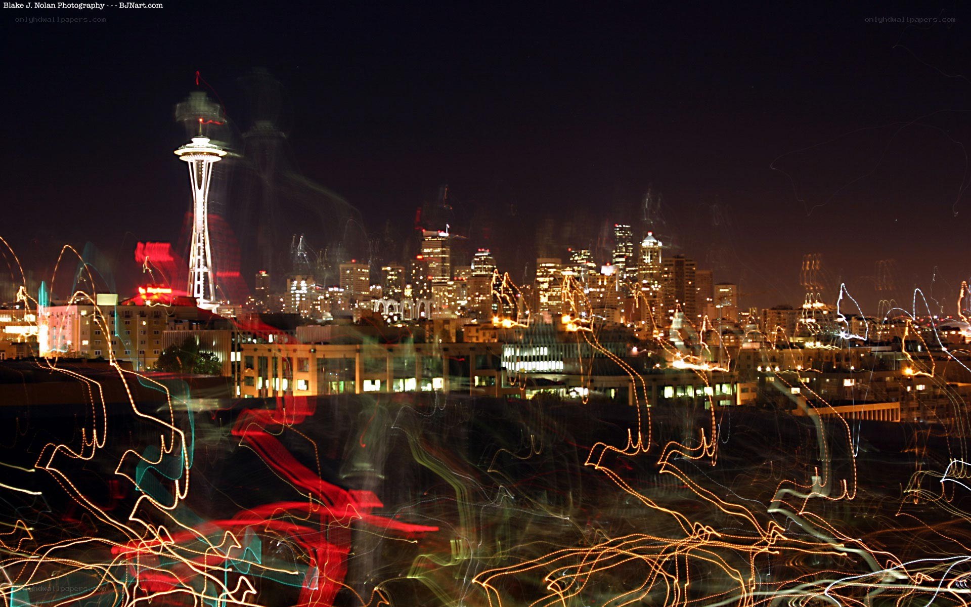 Seattle skyline at night with light trails