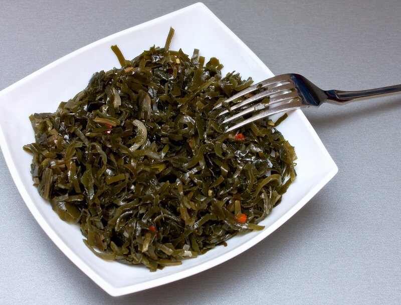 Seaweed salad in a white bowl
