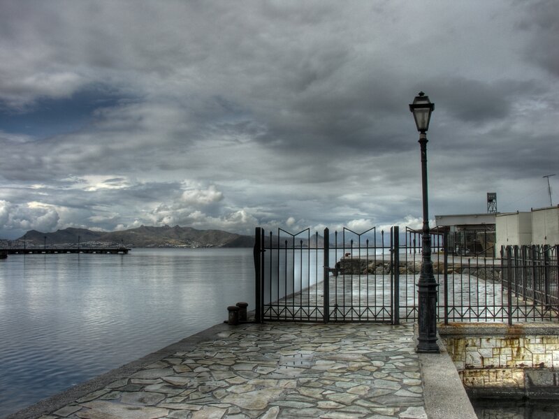 Secluded harbor under cloudy sky