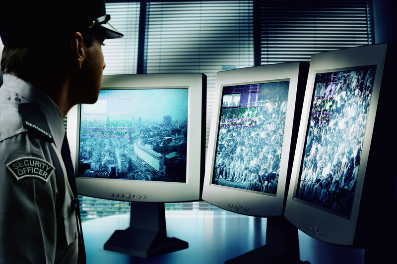 Security officer monitoring screens