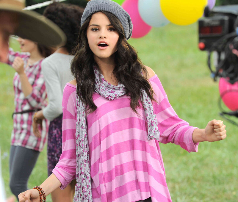 Selena Gomez in pink striped shirt