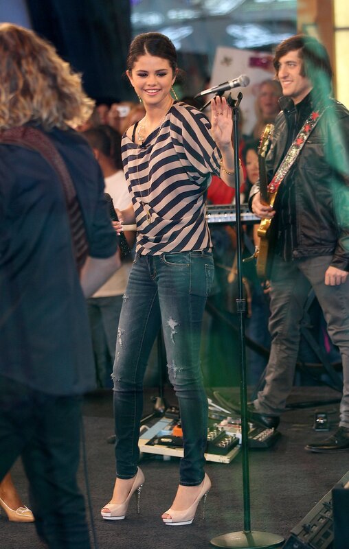 Selena Gomez on stage with band