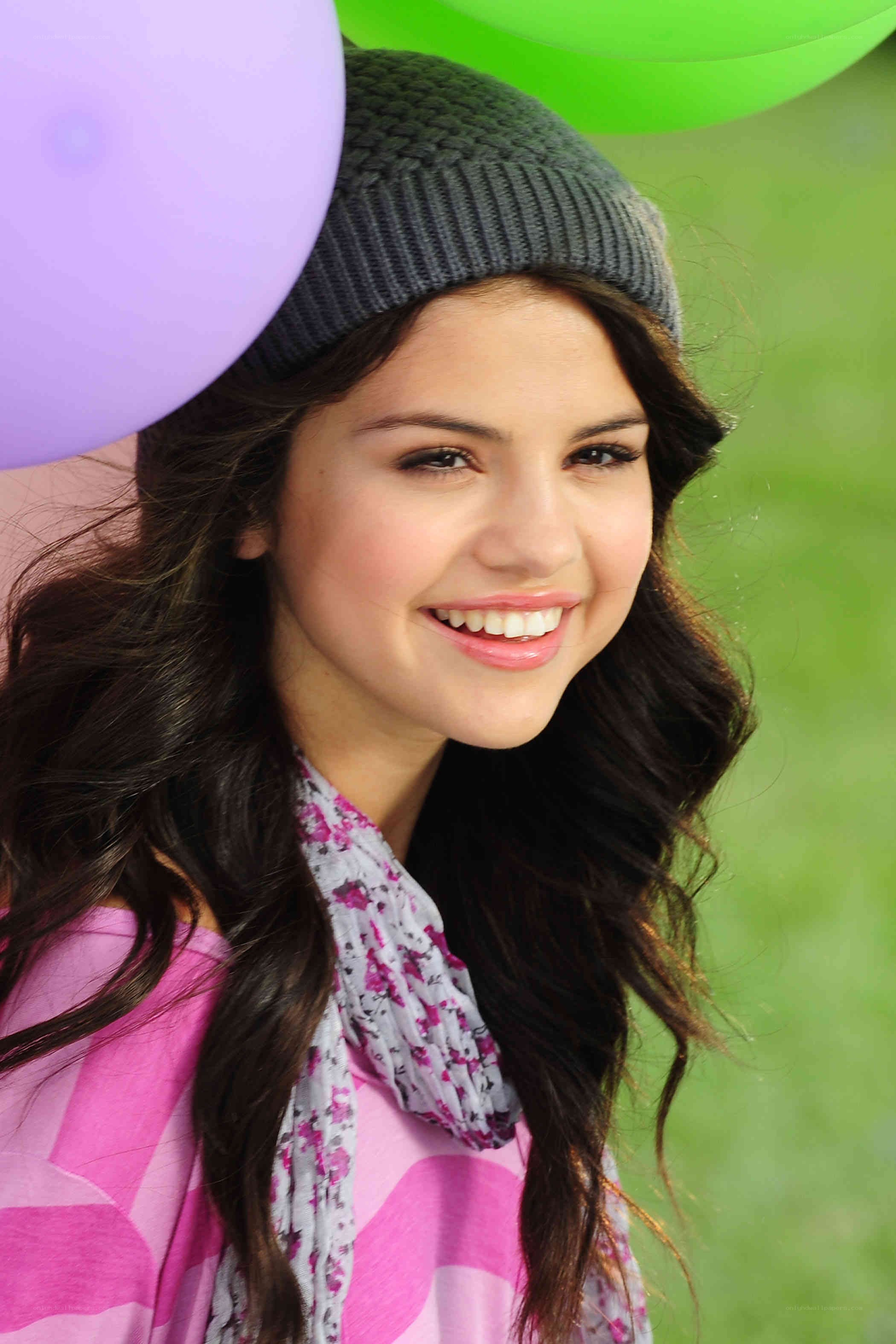 Selena Gomez smiling with balloons