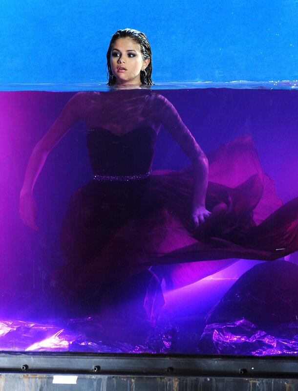 Selena Gomez underwater in a gown