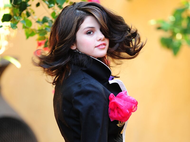 Selena Gomez with pink flower