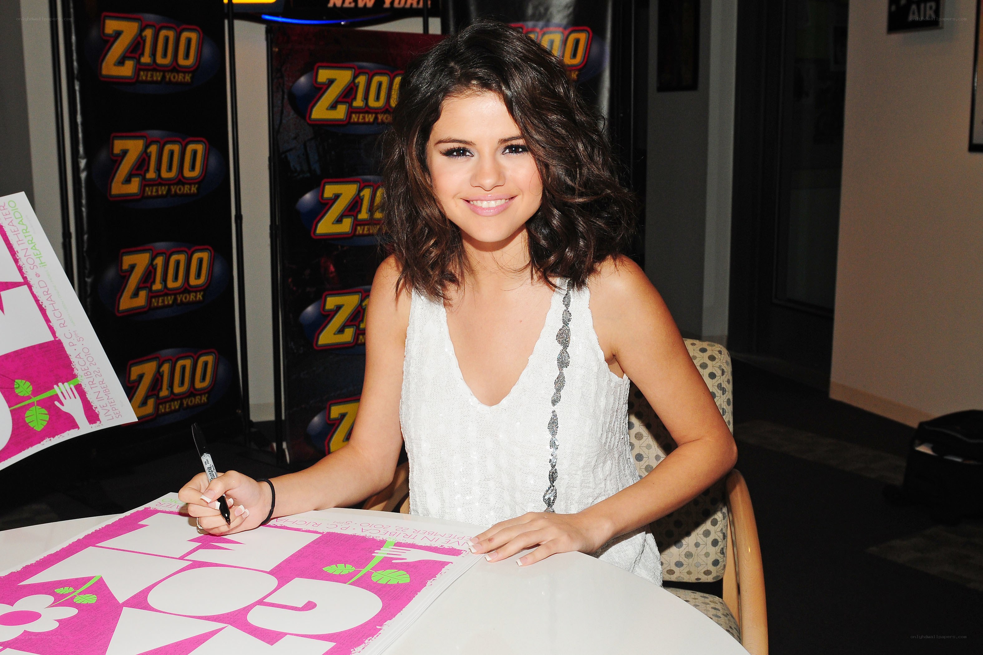 Selena signing autographs