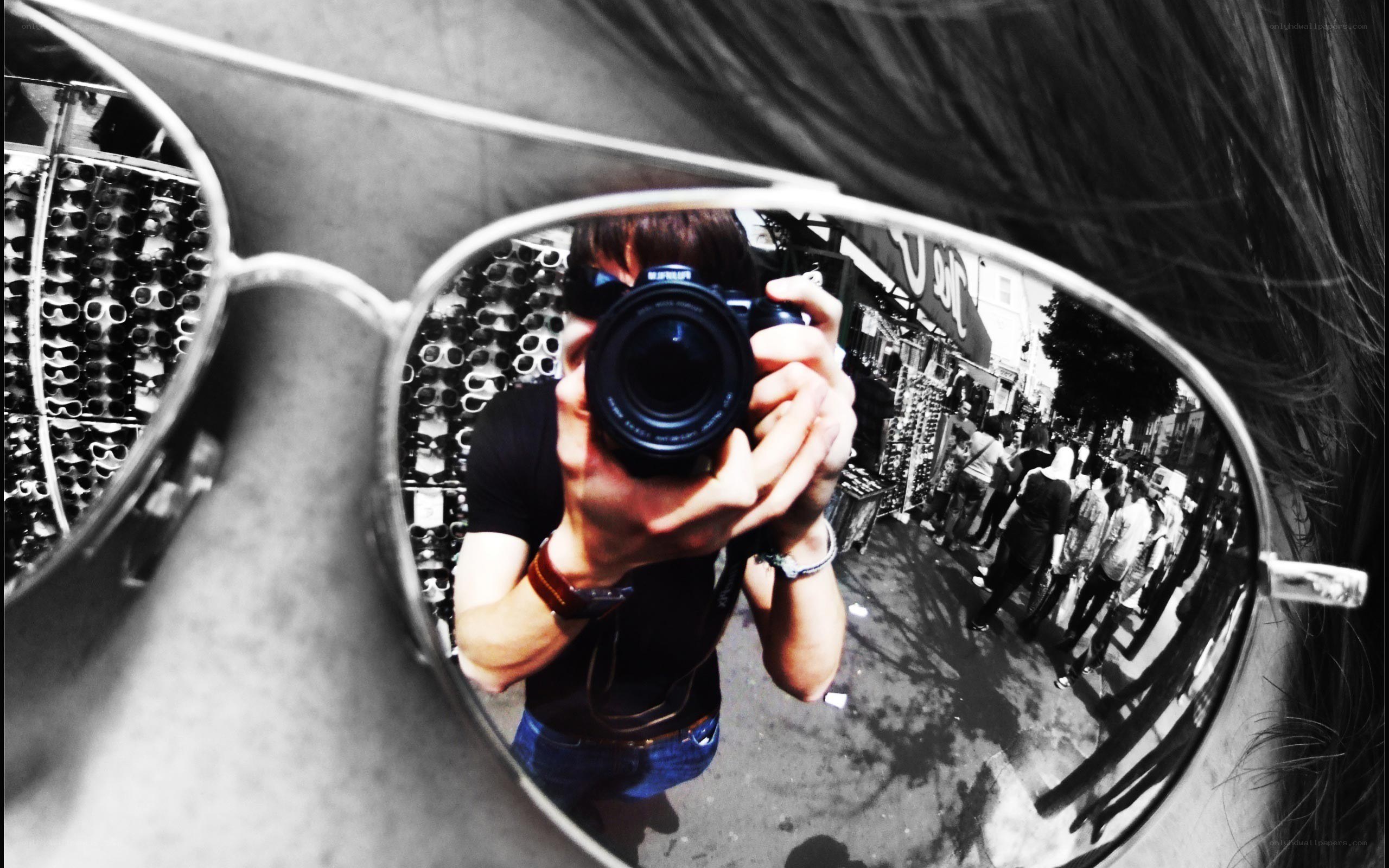 Self-portrait in sunglasses mirror