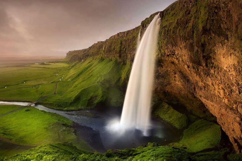 Seljalandsfoss Waterfall — Green, Dramatic, Sunset, Photograph, Cliff, River, Green Field