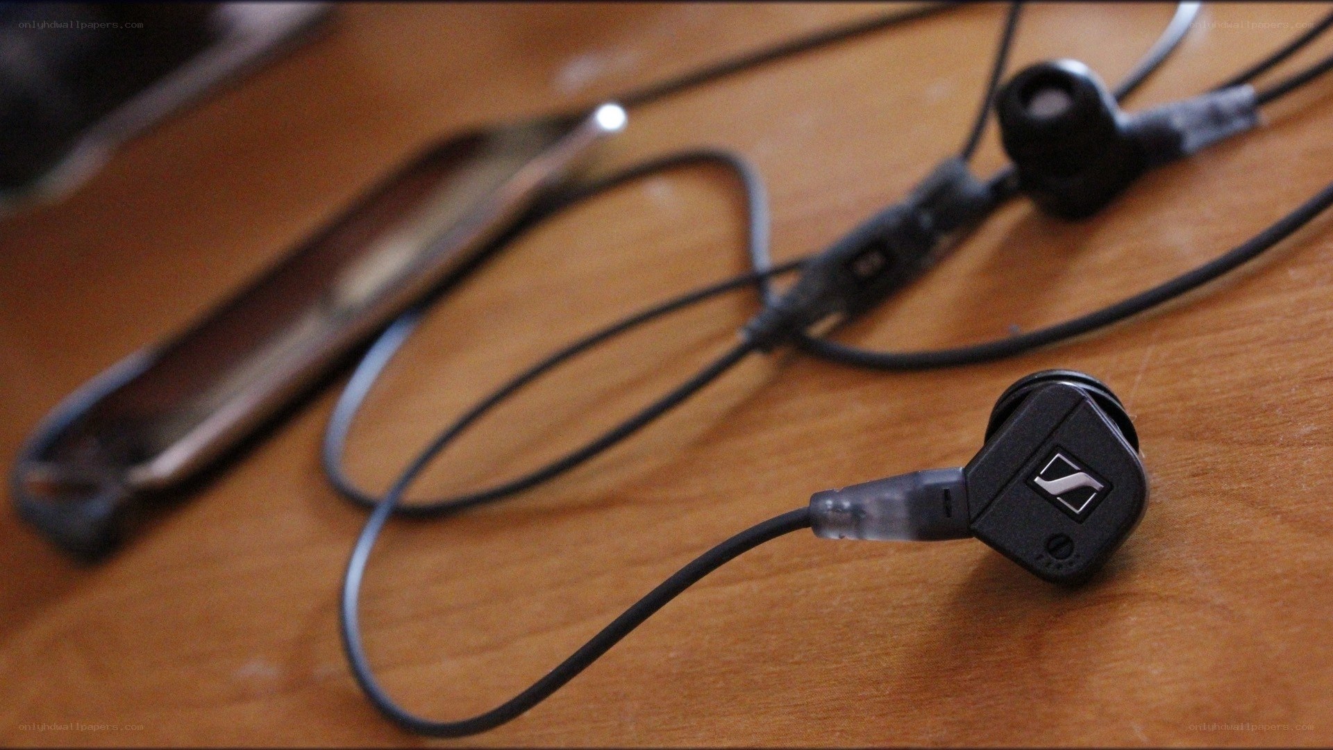 Sennheiser earbuds on wooden table