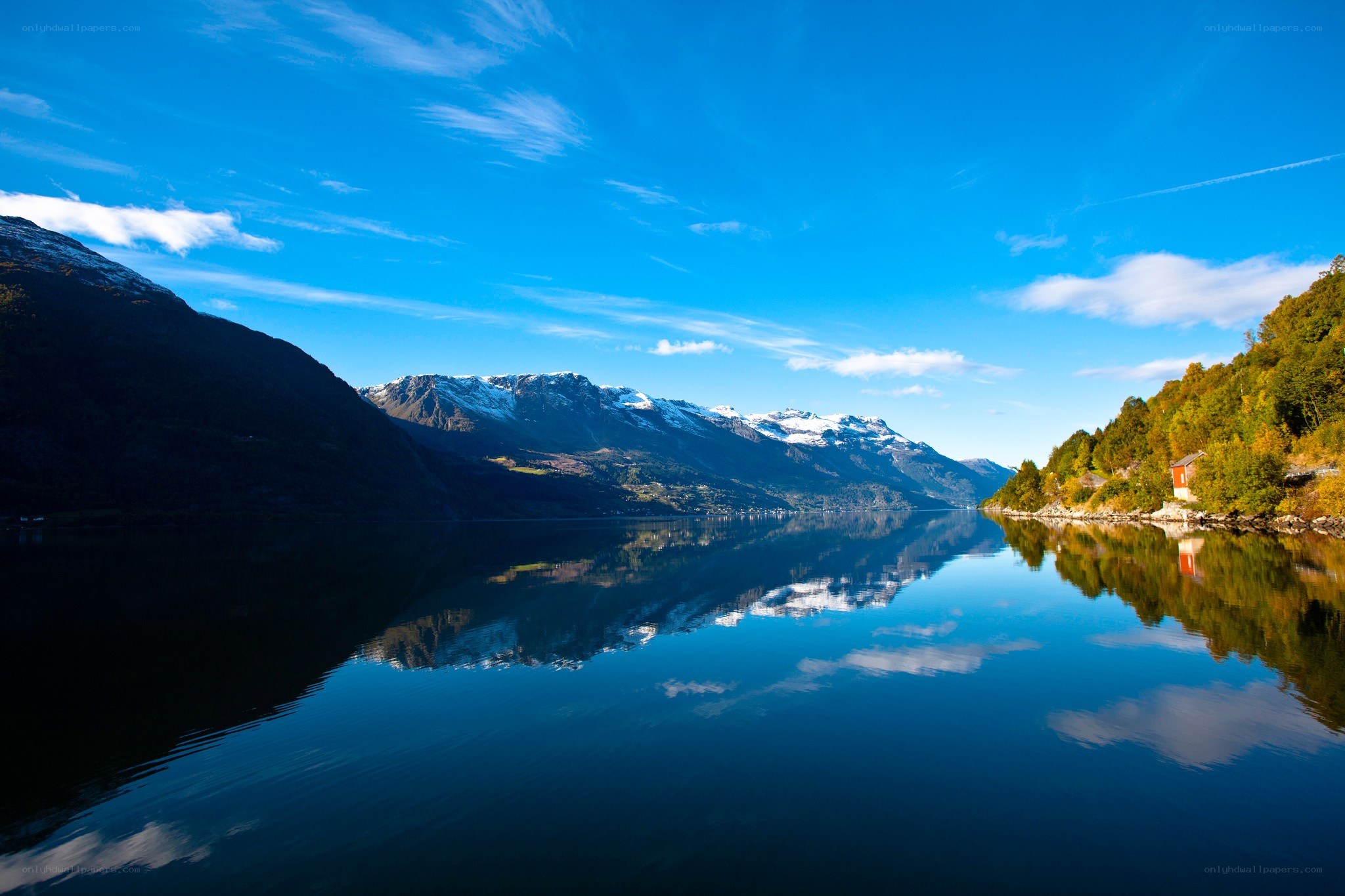 serene fjord with mountain reflections