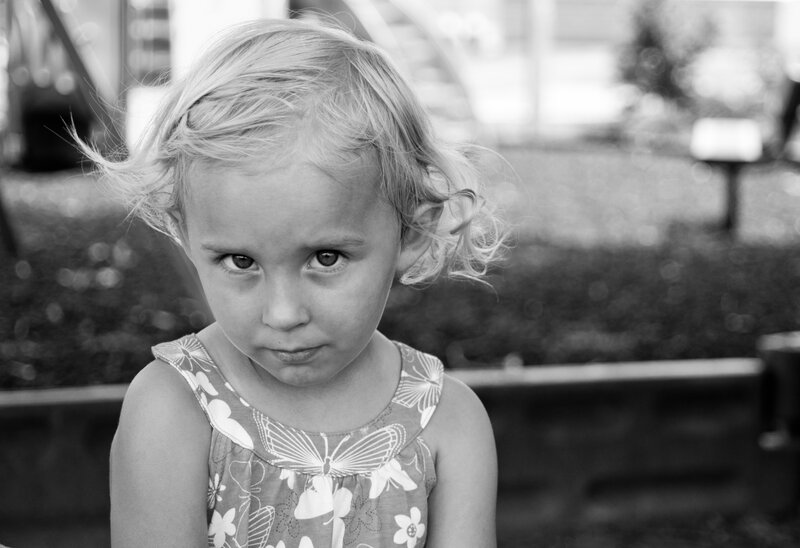 serious young girl in black and white