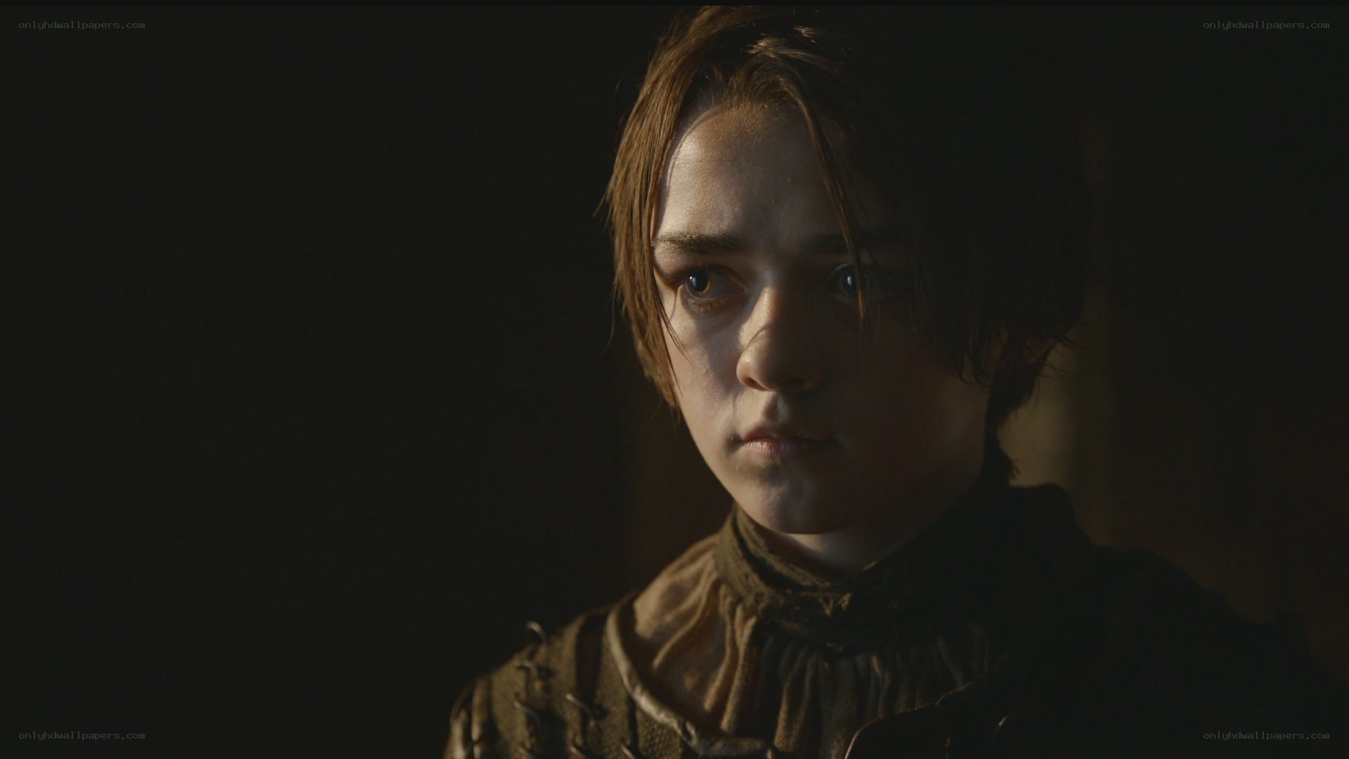 serious young person in dim light
