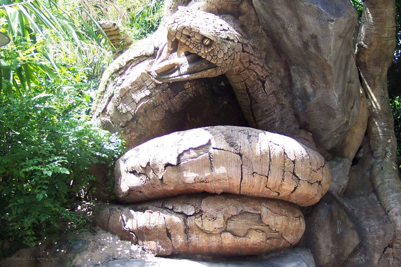 Serpent sculpture in jungle