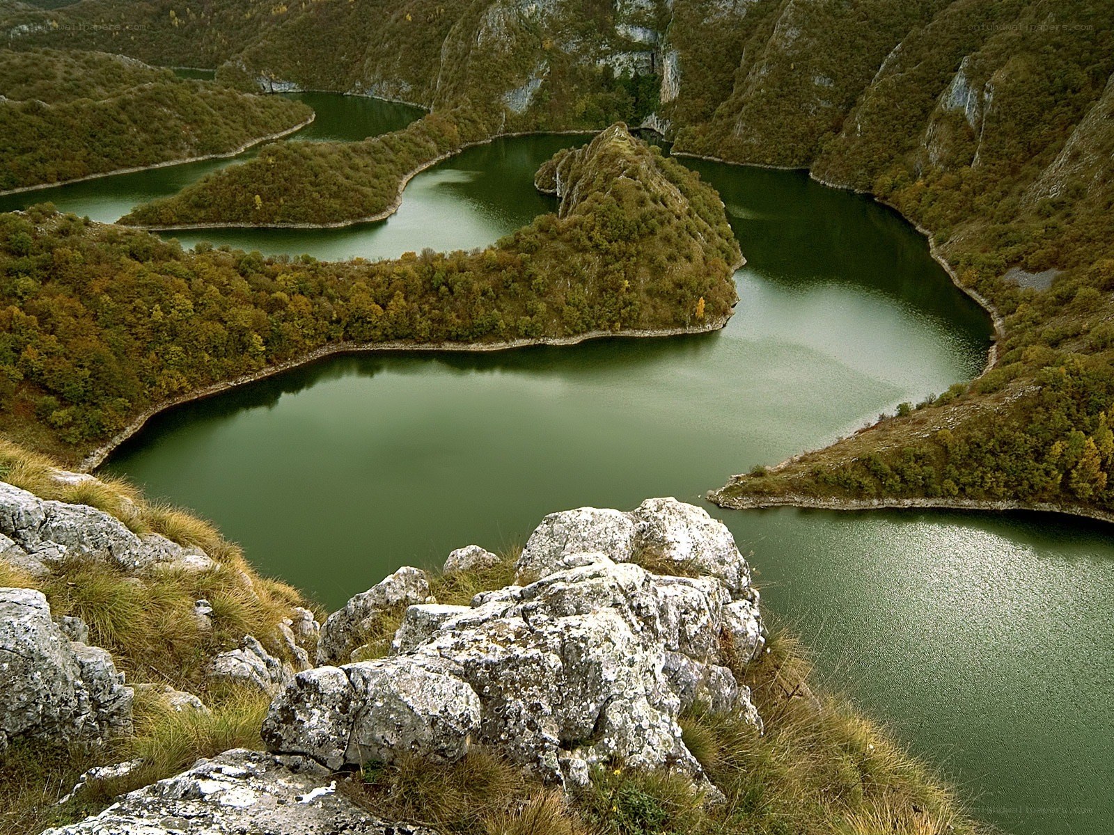 serpentine lake in mountain valley