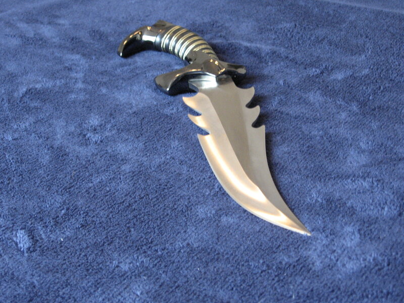 Serrated Dagger on Blue Cloth