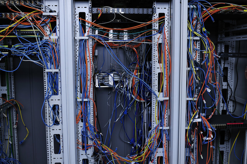 server rack with tangled cables