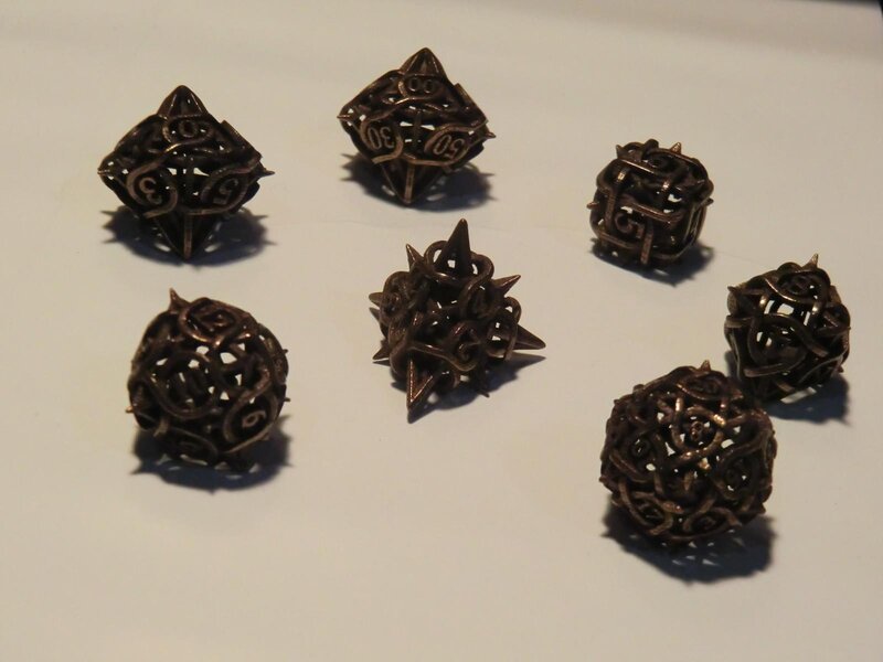 set of intricate metal dice