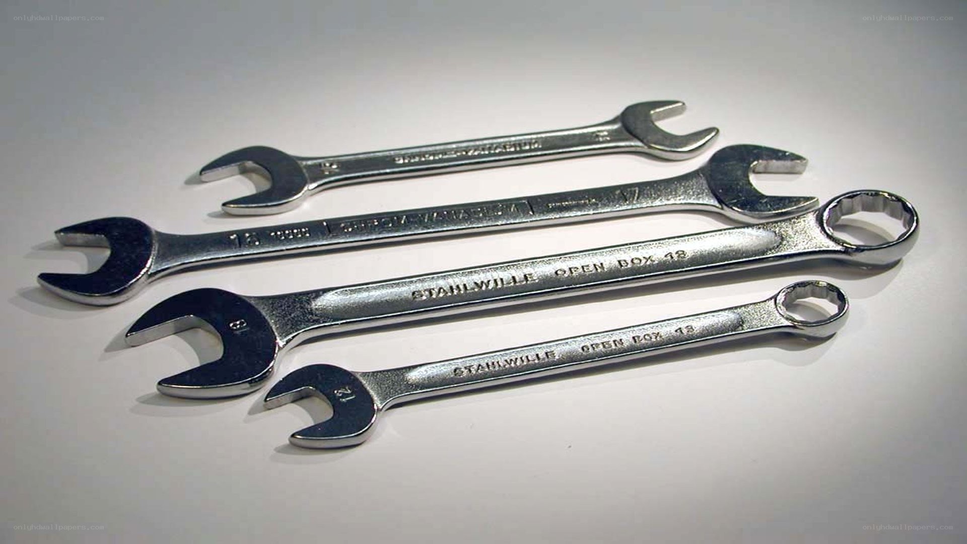 set of wrenches on white surface