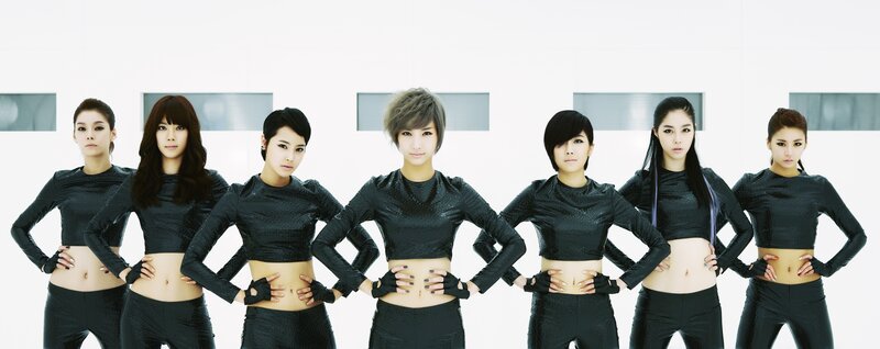 seven women in black outfits