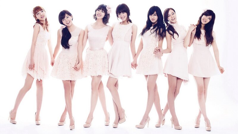 seven women in pink dresses