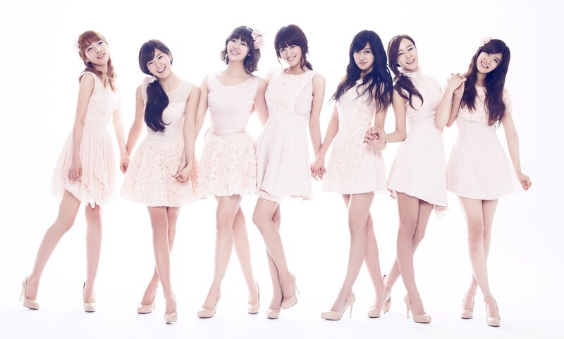 seven women in pink dresses