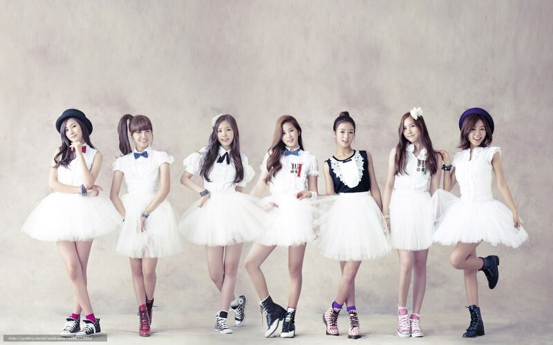 seven women in white dresses