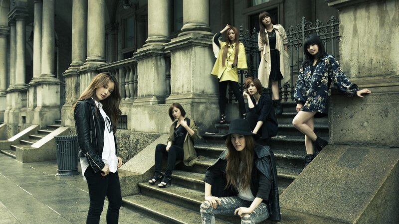 seven women on stone steps