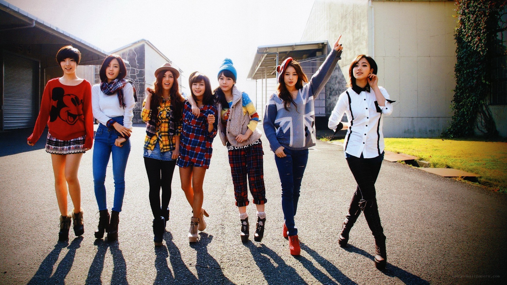 seven women posing outdoors