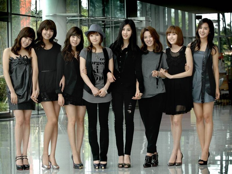 Seven Women Posing Together — Black