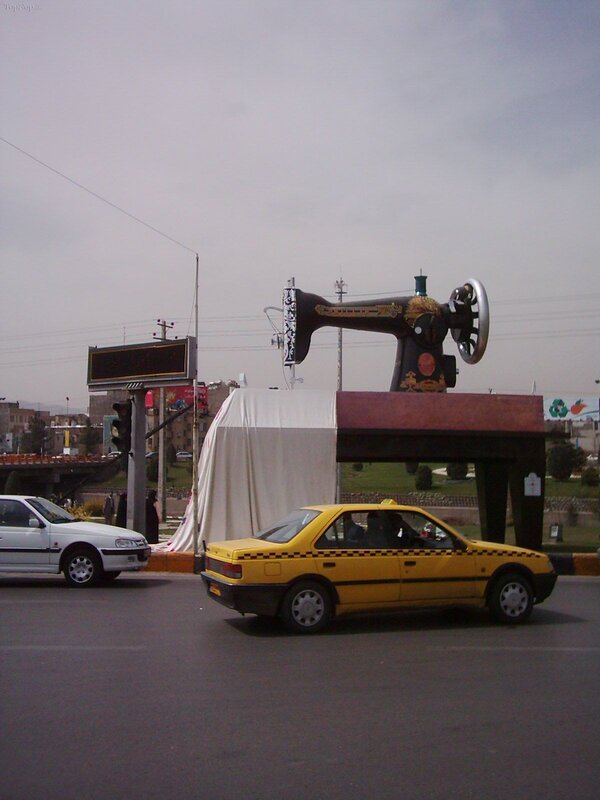 sewing machine sculpture at intersection