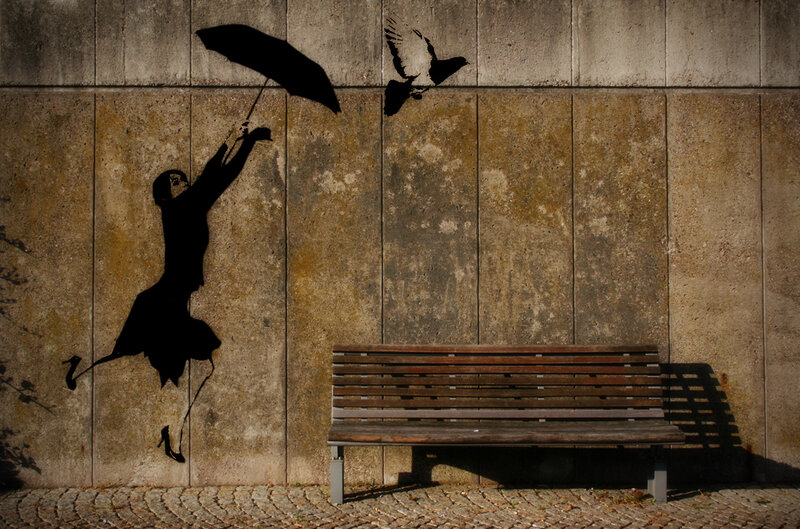 Shadow art of girl with umbrella