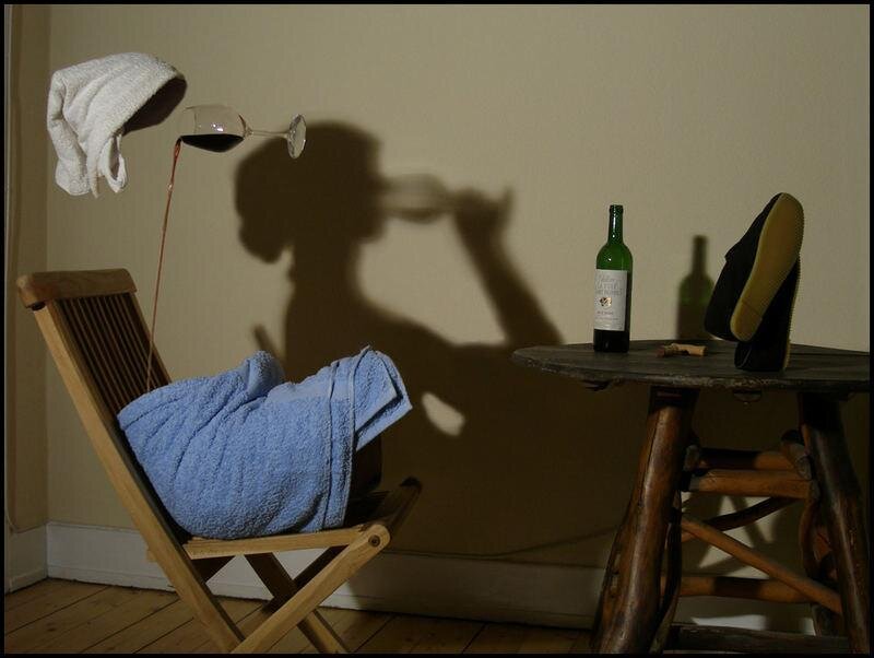 Shadow of a person drinking wine