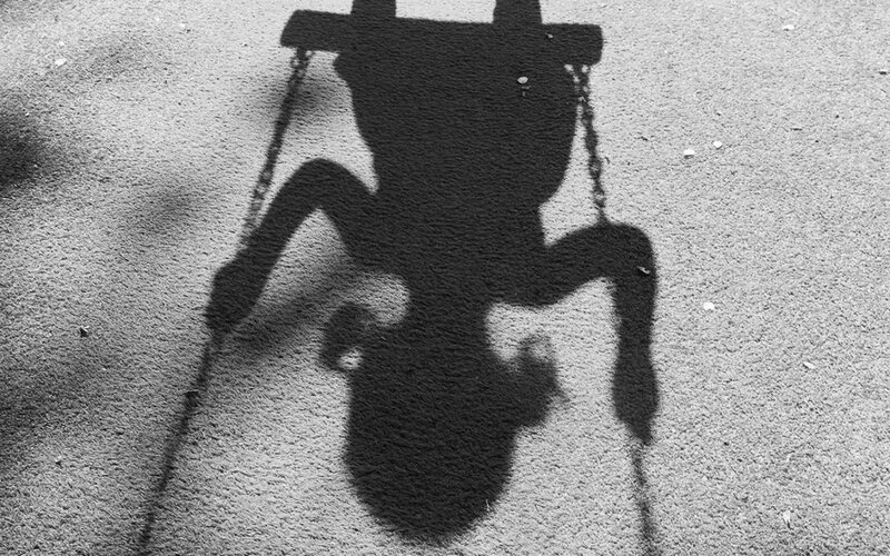 Shadow of Child on Swing