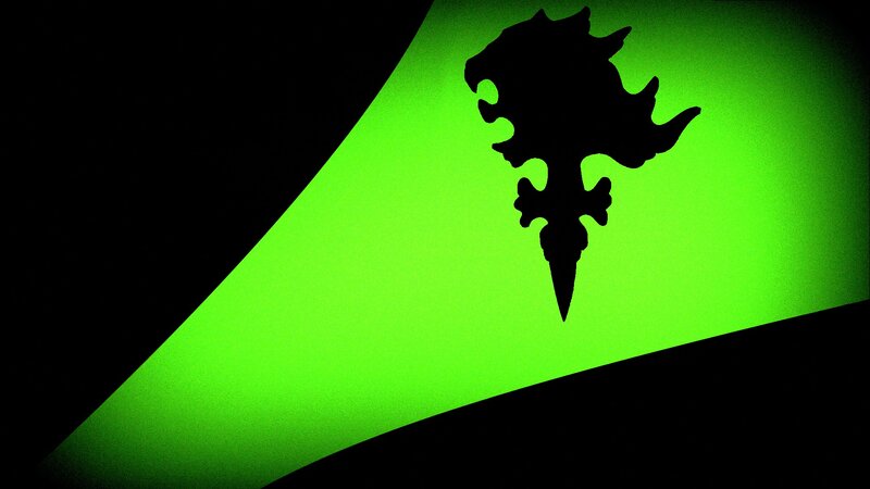 Shadowed emblem on green background