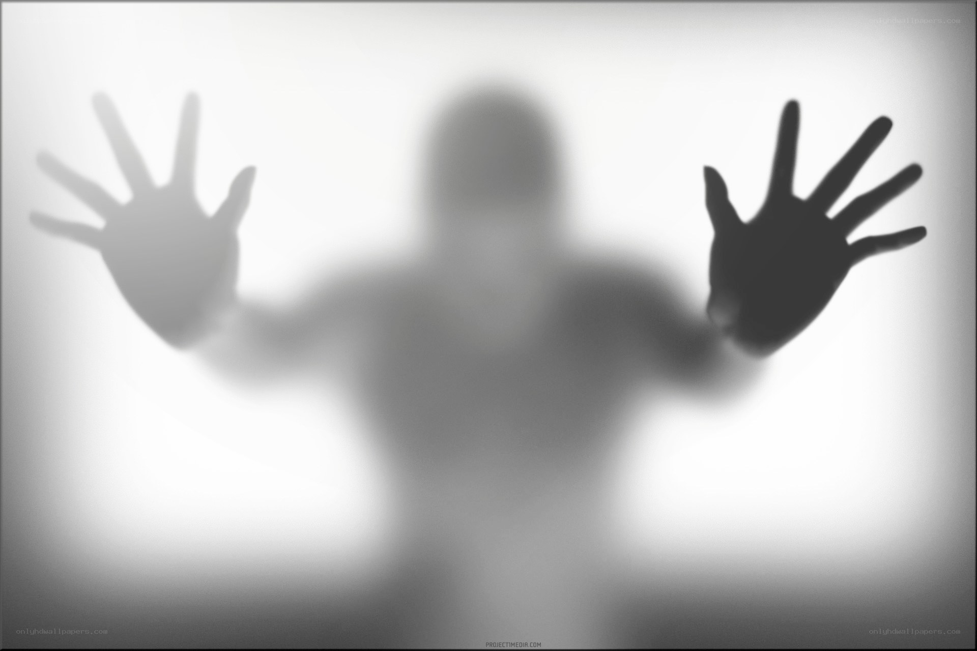 shadowy figure behind glass