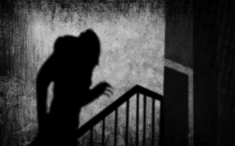 shadowy figure on stairs
