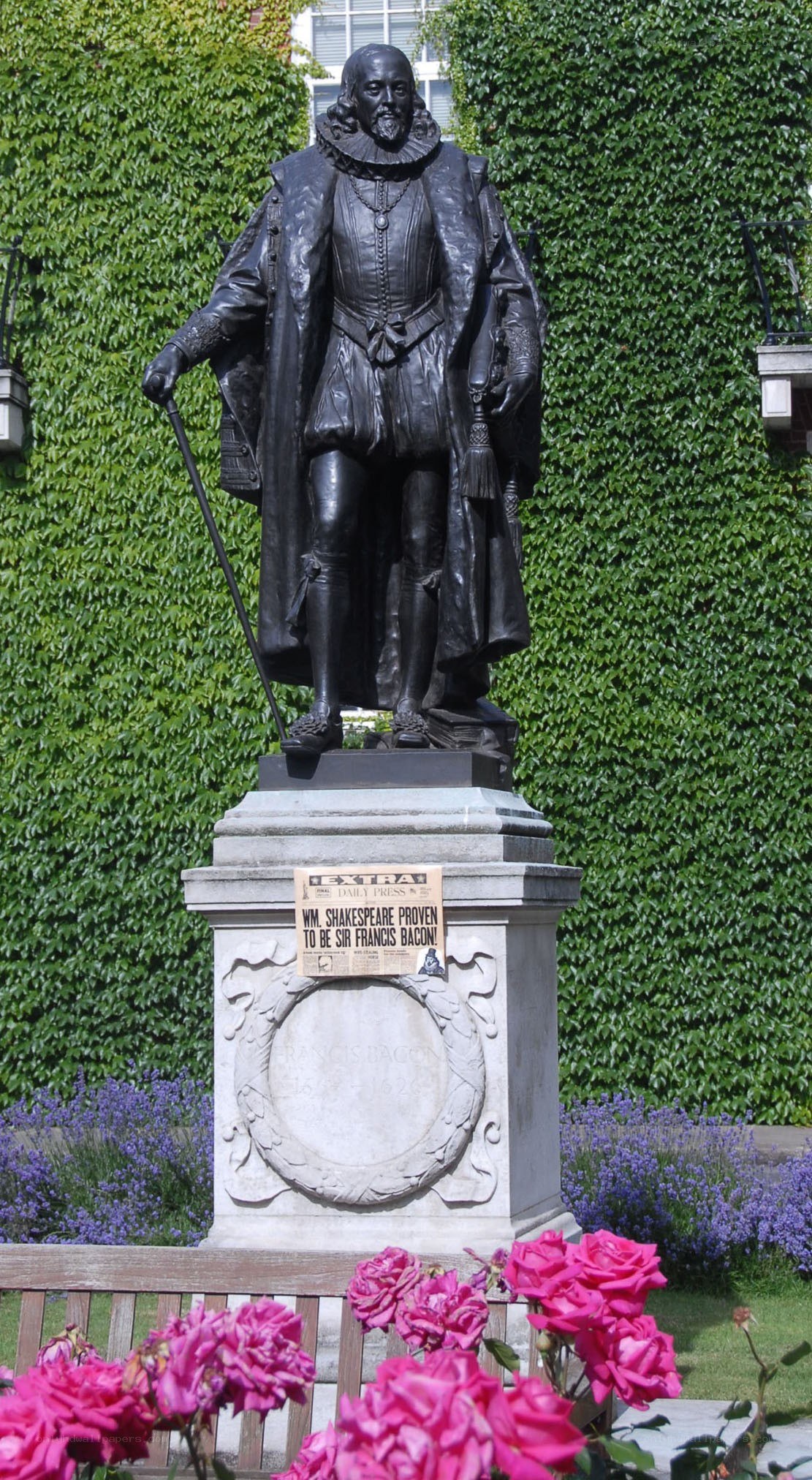Shakespeare statue with prank sign