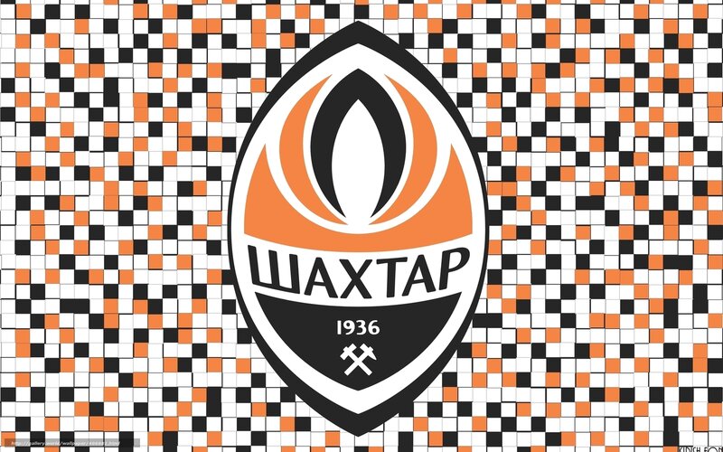 Shakhtar Donetsk logo on checkered background