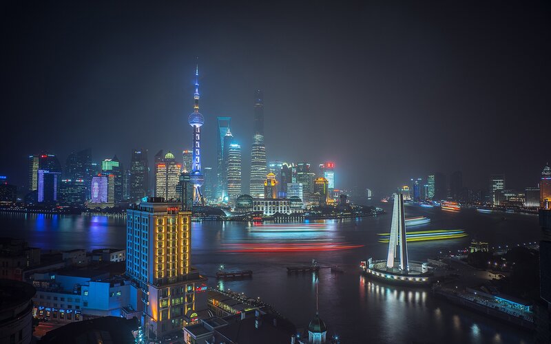 Shanghai Skyline at Night — Black, Dramatic, Photograph, River, Skyscrapers, Boat Lights