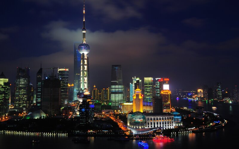 Shanghai Skyline at Night — Black, Dramatic, Photograph, Skyscrapers, River, Boats, Clouds