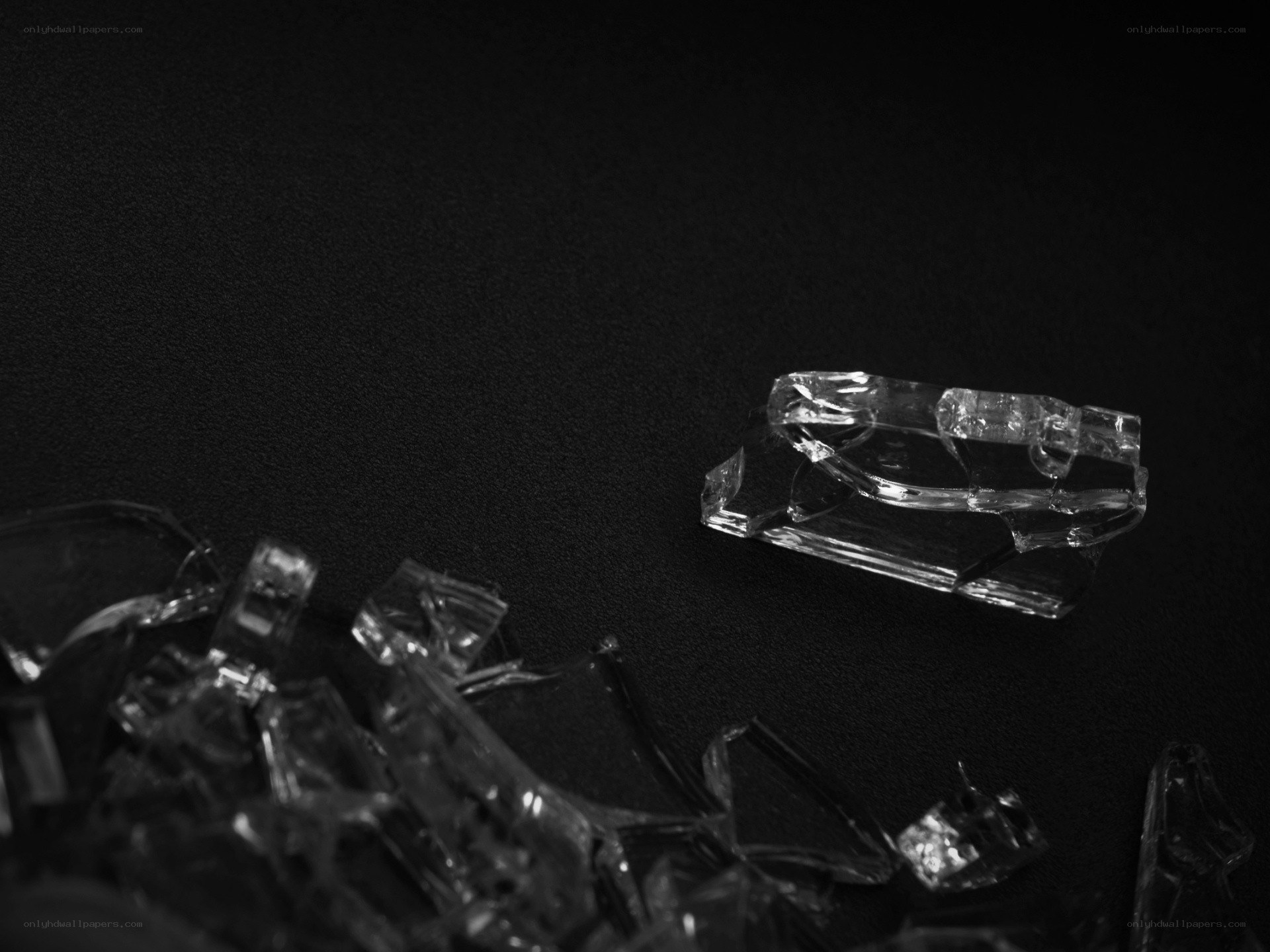 shattered glass on black surface