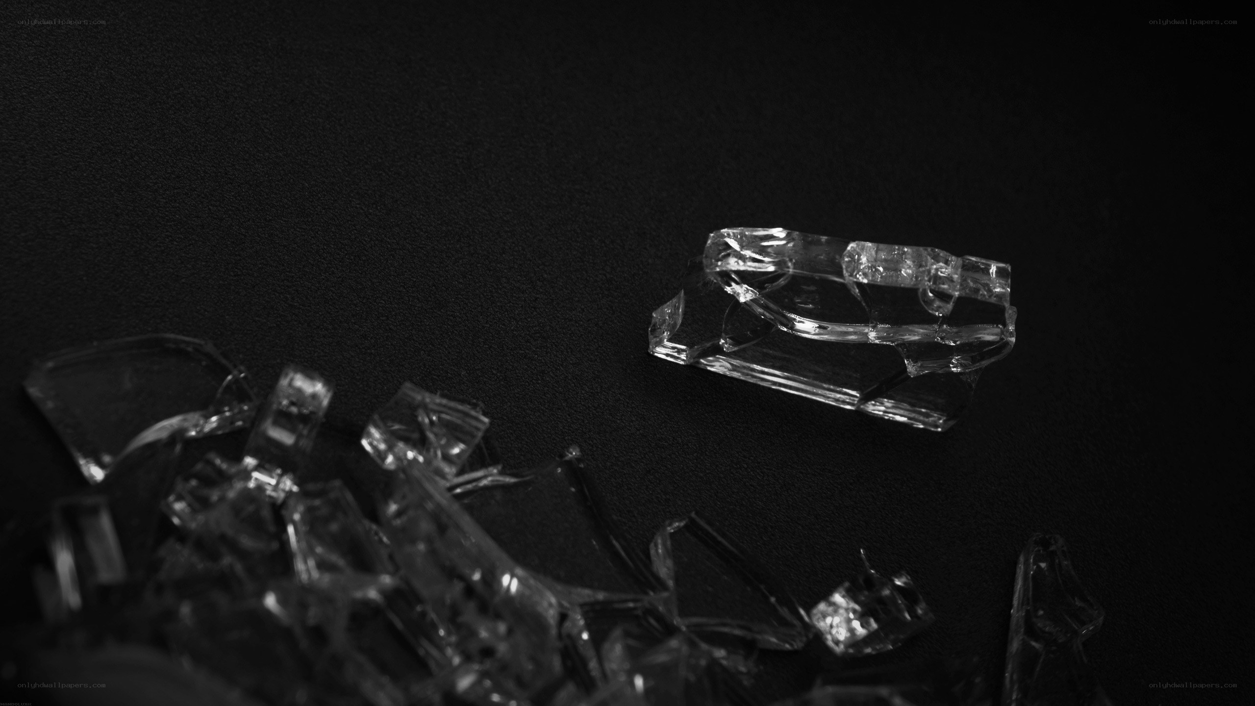 shattered glass on black surface